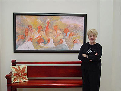 Picture of Pat with Last Supper painting.